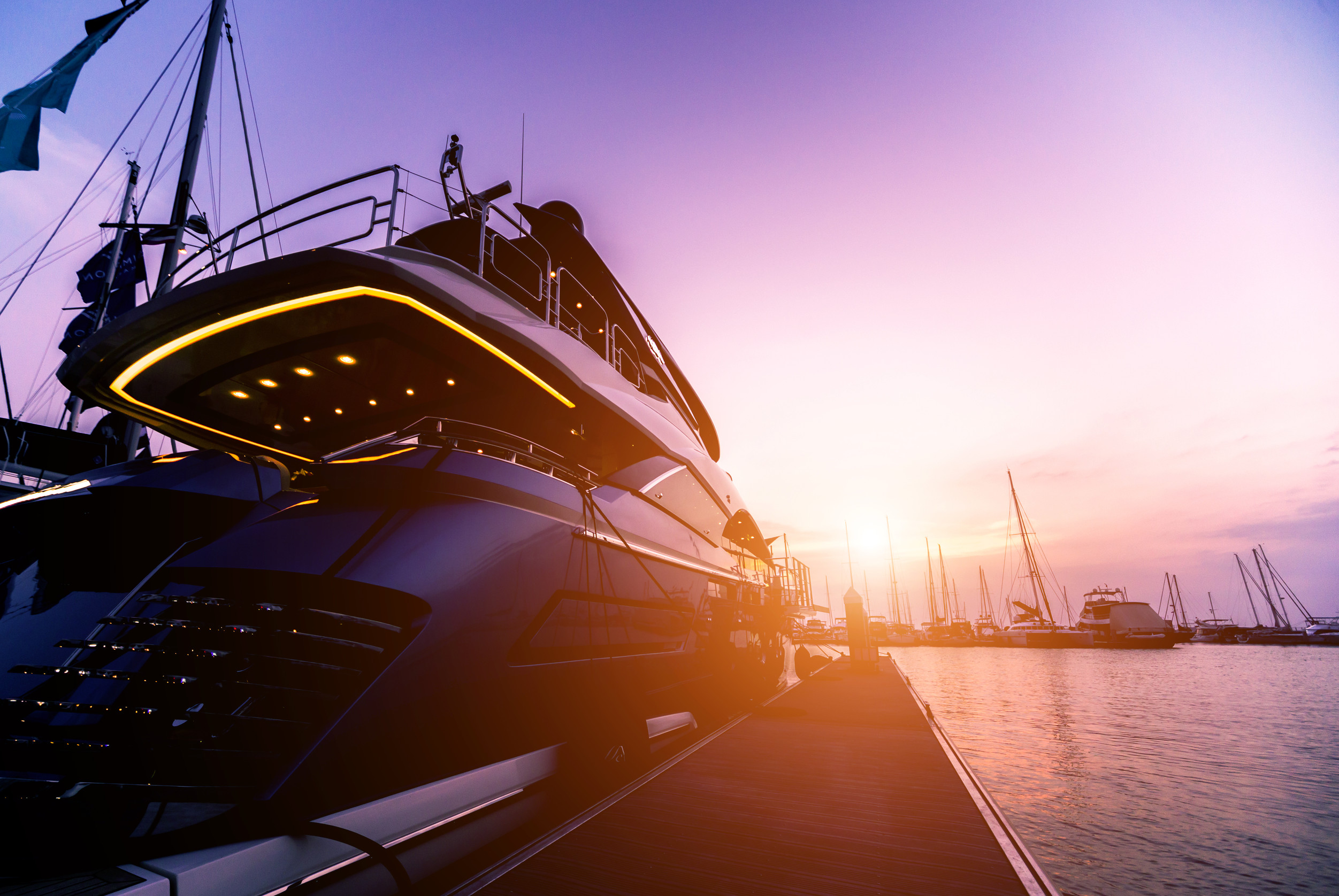 Beautiful view of marina and harbor with yachts and motorboats.